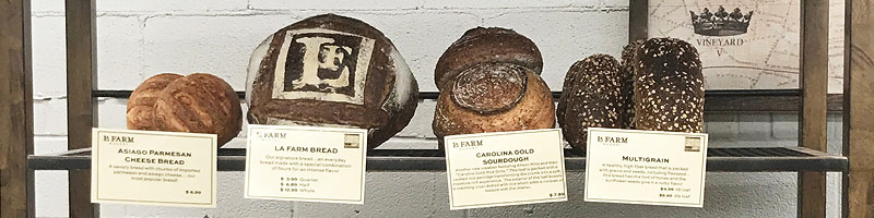Loaves of bread on wooden shelf